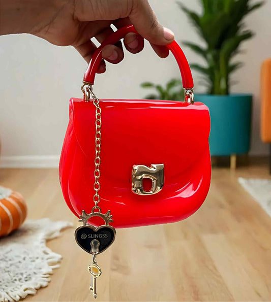 Slingss Mini Partywear Red Silicon Purse For Girls With Handel & Long Belt
