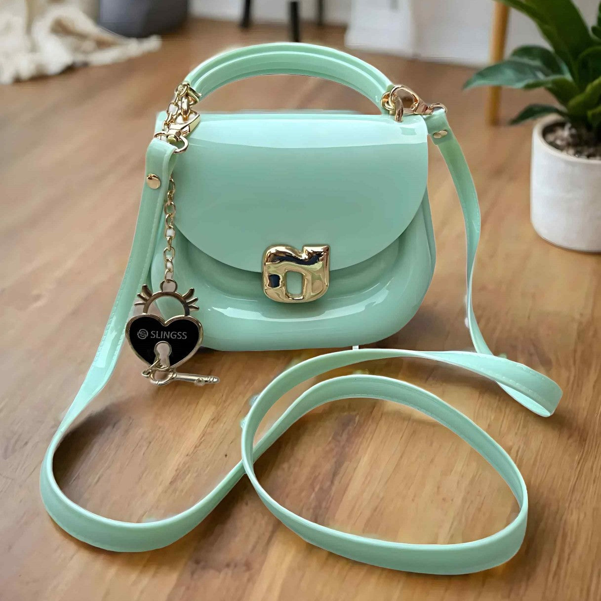 Slingss Mini Partywear Green Silicon Purse For Girls With Handel & Long Belt