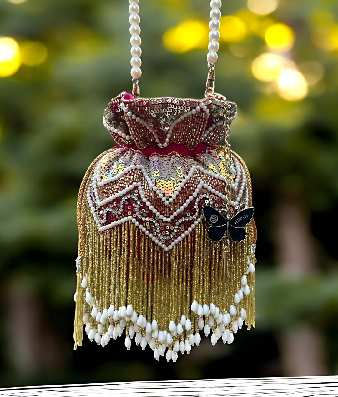 Slingss Premium Partywear Magenta Embroidered Potli For Ladies With White beads Handle