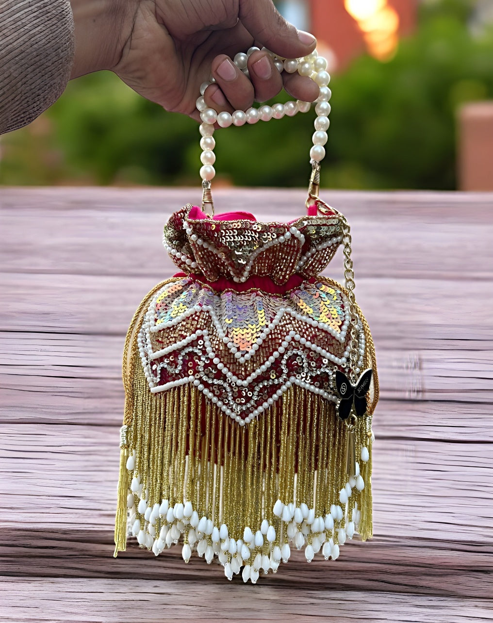 Slingss Premium Partywear Magenta Embroidered Potli For Ladies With White beads Handle